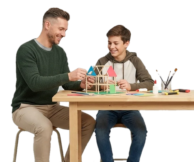Un éducateur et un adolescent construisent une maquette en bois